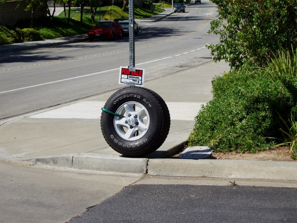 Street Shots: Tire Sale, No. 2 photograph in series.